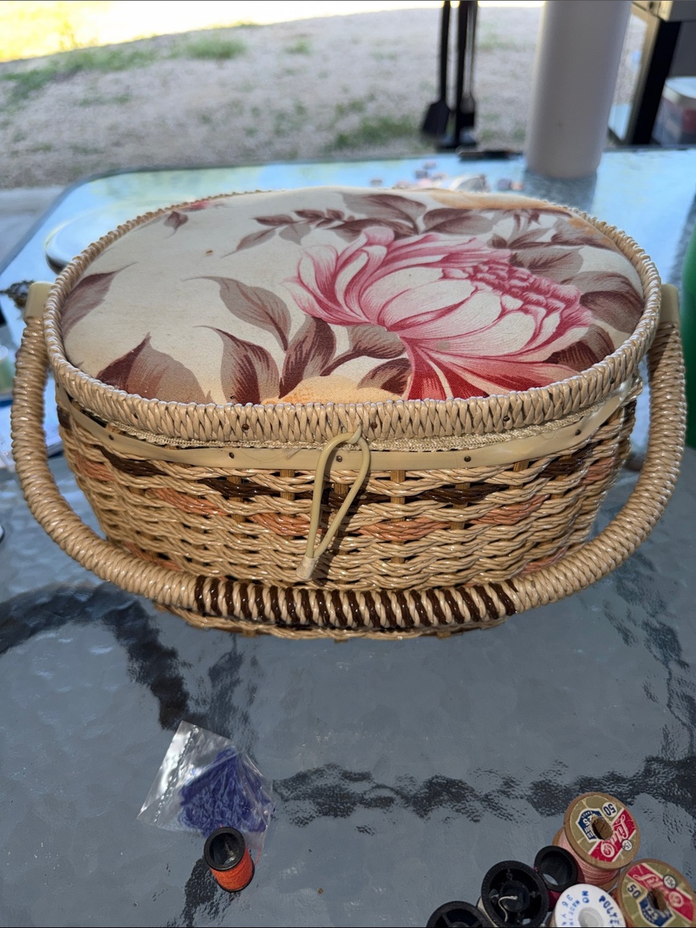 vintage oval wicker sewing basket with a padded floral tapestry lid